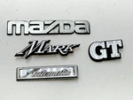 Lot Of Japanese Plastic Emblems Mazda Mark Gt Automatic Fender Ornament. Fixed Price $49.48.