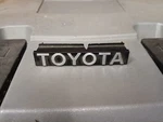 Toyota Celica 86-87 Front Grill Emblem Badge Name Plate New Genuine 75321-20420. Fixed Price $300.00.
