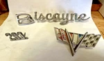 1965 Chevy Biscayne Script Emblem Broken 283 +V8 Lot. Fixed Price $35.00.