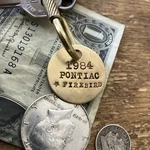 1984 Pontiac Firebird Brass Key Fob. Fixed Price $18.95.