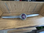 Oem 2014-2017 Fiat 500L 1.4L Front Bumper Wing Trim Badge Shield Emblem. Fixed Price $75.00.