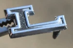 1966 Plymouth Valiant "l" Emblem 2528975 Oem Mopar. Fixed Price $24.99.