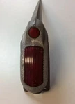 1951-1952 Oldsmobile Rh Tail Light Guide R3-51B With Mounting BRACKET.W39. Fixed Price $150.00.