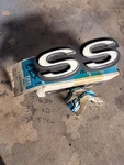 Nos Gm 1969 Chevrolet Camaro Ss Taillight Panel Emblem Part # 8701110. Fixed Price $249.00.