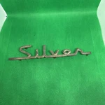 Studebaker 1324940 Num "silver" Script 1957-59 Cars Hawk. Fixed Price $10.00.
