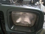 Surrounding Trim Driver Left Headlight Door/cover Painted Fits 87-95 Wrangler 14. Fixed Price $24.00.